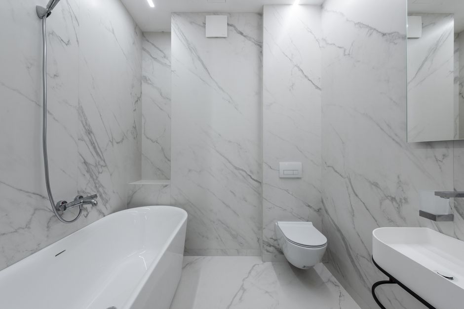 Professional installing new bathroom floor tile